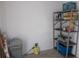 Utility storage room with shelving unit and adjacent equipment at 358 Longwood Dr, Venice, FL 34285