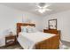 Bright bedroom with a ceiling fan, carpet, geometric patterned rug, and a relaxing, beachy vibe at 360 Base E Ave # 413, Venice, FL 34285