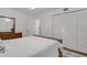 Bright bedroom with large closet, neutral carpet, and comfortable woven headboard at 360 Base E Ave # 413, Venice, FL 34285