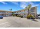 Exterior of condo complex with multiple units, balconies, and convenient parking at 360 Base E Ave # 413, Venice, FL 34285