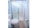 Clean bathroom featuring a glass-enclosed shower and a white toilet at 400 Base # 225, Venice, FL 34293