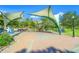 Outdoor park offering a picnic area with shade structures, picnic tables, and lush greenery at 400 Base # 225, Venice, FL 34293