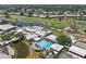 Beautiful aerial view of the clubhouse with community pool, and golf course in a serene community at 406 Cerromar N Cir # 128, Venice, FL 34293