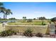 Balcony view overlooking the lush golf course and lake at 406 Cerromar N Cir # 128, Venice, FL 34293