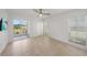 This room features tile floors, windows, and a sliding glass door to the patio at 406 Cerromar N Cir # 128, Venice, FL 34293