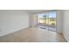 This room has tile floors and a sliding glass door to the outside at 406 Cerromar N Cir # 128, Venice, FL 34293
