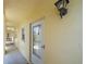 Inviting condo entrance featuring secure door and covered walkway for easy access in all weather conditions at 406 Cerromar N Cir # 128, Venice, FL 34293