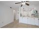 Open-concept featuring a kitchenette with counter seating and views of the living space at 406 Cerromar N Cir # 128, Venice, FL 34293