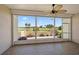 Enclosed lanai with tiled floor offers panoramic views of the manicured golf course and tropical landscaping at 406 Cerromar N Cir # 128, Venice, FL 34293