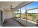 Enclosed lanai with tiled floor offers beautiful views of the manicured golf course and tropical landscaping at 406 Cerromar N Cir # 128, Venice, FL 34293