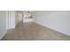This spacious living area features tile flooring, white walls, and natural light at 406 Cerromar N Cir # 128, Venice, FL 34293