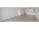 This is an open living space with tile floors and white walls at 406 Cerromar N Cir # 128, Venice, FL 34293