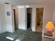 Bedroom showcasing open doorways to a closet, bedroom, and bathroom at 411 Cervina N Dr # 493, Venice, FL 34285