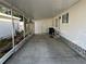 Covered carport attached to a home, with access doors and exterior features visible at 411 Cervina N Dr # 493, Venice, FL 34285