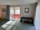 Inviting living room featuring an open doorway to a brightly lit sunroom at 411 Cervina N Dr # 493, Venice, FL 34285