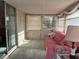 Relaxing sunroom featuring a comfortable daybed and plenty of natural light at 411 Cervina N Dr # 493, Venice, FL 34285