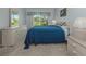 Cozy bedroom boasts soft carpet, ample natural light, and neutral tones for relaxation at 416 Laurel Lake Dr # 103, Venice, FL 34292
