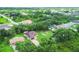 Aerial view of a single-Gathering home with a brick driveway on a large lot at 431 Sevilla St, North Port, FL 34287