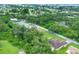 Wide aerial view of property, road and greenery including neighborhood overview at 431 Sevilla St, North Port, FL 34287