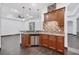 Kitchenette with granite countertops, stainless steel dishwasher, and wooden cabinets at 431 Sevilla St, North Port, FL 34287
