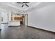 Open floor plan featuring living room adjacent to kitchen with stainless steel appliances and wooden cabinets at 431 Sevilla St, North Port, FL 34287