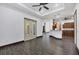 Spacious living room featuring tile floors, ceiling fan, and french doors leading to a patio at 431 Sevilla St, North Port, FL 34287