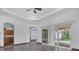 Open floor plan showcasing living room with sliding glass doors and adjacent kitchen at 431 Sevilla St, North Port, FL 34287