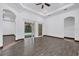 Spacious living room with dark trim, tile floors, and sliding glass doors to outdoor patio at 431 Sevilla St, North Port, FL 34287