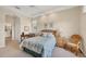 Cozy bedroom featuring lake views, neutral decor, and comfortable furniture at 4427 Blue Heron Cir, North Port, FL 34287