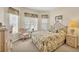 Cozy bedroom with floral bedding, woven accents, and natural light at 4427 Blue Heron Cir, North Port, FL 34287