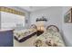 Inviting bedroom with twin beds, nautical decor, and natural light at 4427 Blue Heron Cir, North Port, FL 34287