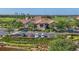 Clubhouse exterior featuring manicured landscaping, parking and golf carts at 4427 Blue Heron Cir, North Port, FL 34287