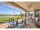 Charming lanai with lake views, dining set, and comfortable seating at 4427 Blue Heron Cir, North Port, FL 34287