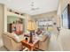 Bright living room featuring comfortable seating, a view of the lake, and neutral decor at 4427 Blue Heron Cir, North Port, FL 34287