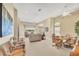 Open floor plan living room and dining area with lake views at 4427 Blue Heron Cir, North Port, FL 34287