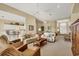 Bright living room featuring neutral tones, comfortable seating, and an open floor plan at 4427 Blue Heron Cir, North Port, FL 34287