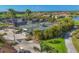 Aerial view of tennis courts, golf course, and lush tropical landscaping in a beautiful community at 4427 Blue Heron Cir, North Port, FL 34287