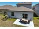 An inviting outdoor patio with a dining set perfect for entertaining and relaxation in the backyard at 4523 Birdsong Dr, Palmetto, FL 34221