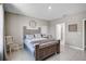 Serene bedroom features a comfortable bed, neutral decor, and tiled flooring at 4523 Birdsong Dr, Palmetto, FL 34221