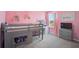 Vibrant pink bedroom with stylish decor including a loft bed and a vanity at 4523 Birdsong Dr, Palmetto, FL 34221
