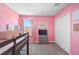 Vibrant pink bedroom with stylish decor including a loft bed and a TV at 4523 Birdsong Dr, Palmetto, FL 34221