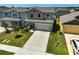 Attractive two-story home with a well-kept lawn and landscaped front yard at 4523 Birdsong Dr, Palmetto, FL 34221