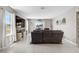 Bright living room with tile flooring and a large window, creating an open and airy space at 4523 Birdsong Dr, Palmetto, FL 34221