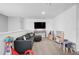 Bright living area features a plush sectional sofa, TV, and play area at 4523 Birdsong Dr, Palmetto, FL 34221