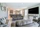 Open-concept living room with a view into the kitchen and dining area, perfect for entertaining at 4523 Birdsong Dr, Palmetto, FL 34221