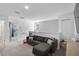 Upstairs loft with a comfortable gray sectional sofa and views from the window at 4523 Birdsong Dr, Palmetto, FL 34221