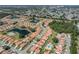 Community aerial showing multiple homes surrounding lakes, greenery, and manicured lawns at 4885 Tamarack Trl, Venice, FL 34293