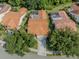 Aerial view of home showing roof, lawn and landscaping in an established community at 4885 Tamarack Trl, Venice, FL 34293