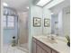 Bathroom with a walk-in shower, a vanity, and a window at 511 Governors Green Dr, Venice, FL 34293