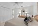 Cozy bedroom featuring a ceiling fan and queen bed with pillows at 511 Governors Green Dr, Venice, FL 34293
